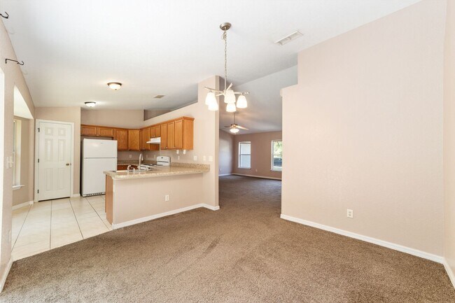 Building Photo - Peaceful 3-Bedroom Home with Open Floor Plan & Two-Car Garage in Rainbow Lakes Estates!