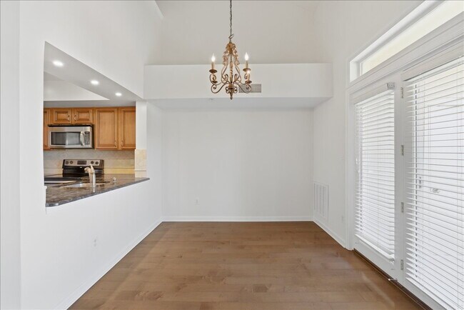 Building Photo - "Luxurious 2-Bed Condo with, loft, Granite Elegance & Hardwood Charm in Reston, VA!"