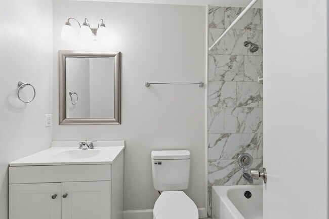Building Photo - Experience contemporary living in this beautifully renovated residence where modern design meets ...