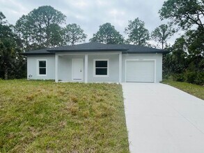 Building Photo - BRAND NEW CONSTRUCTION- ONE OF A KIND-ONE BEDROOM, ONE BATH-ONE CAR GARAGE- LEHIGH ACRES