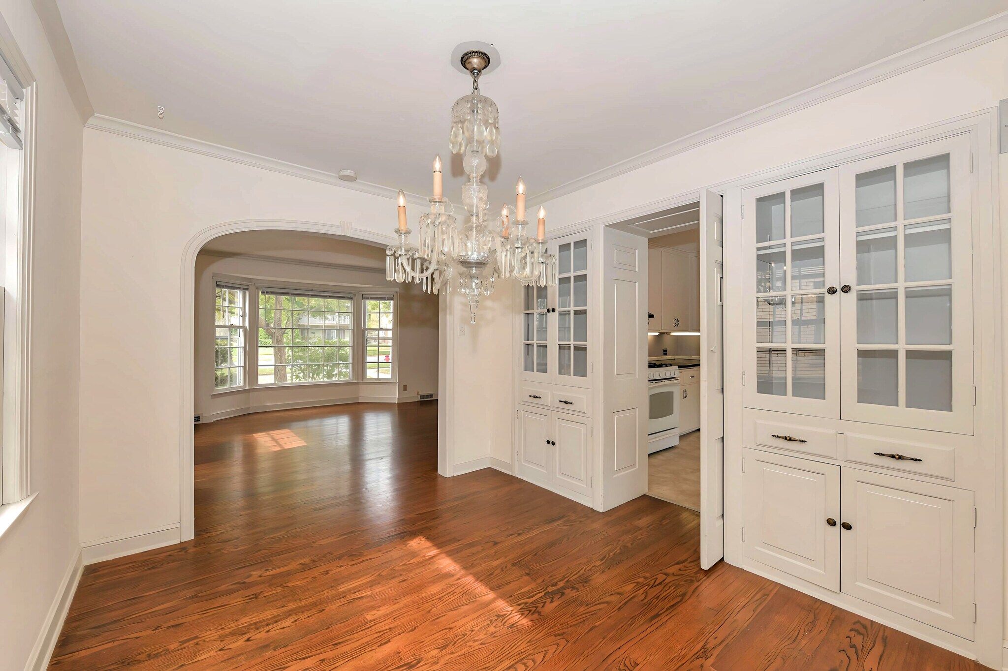 Dining room view with built-ins. Chandelier to be replace with black chandelier prior to move-in. - 2734 N Avondale Blvd