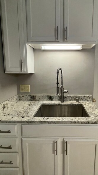 Granite in kitchen and half bath - 1506 N Jefferson St