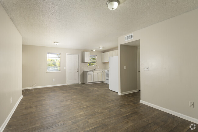 3BR, 1BA - 1,050SF - Living Room / Kitchen - The Pines at Farrow Apartments    