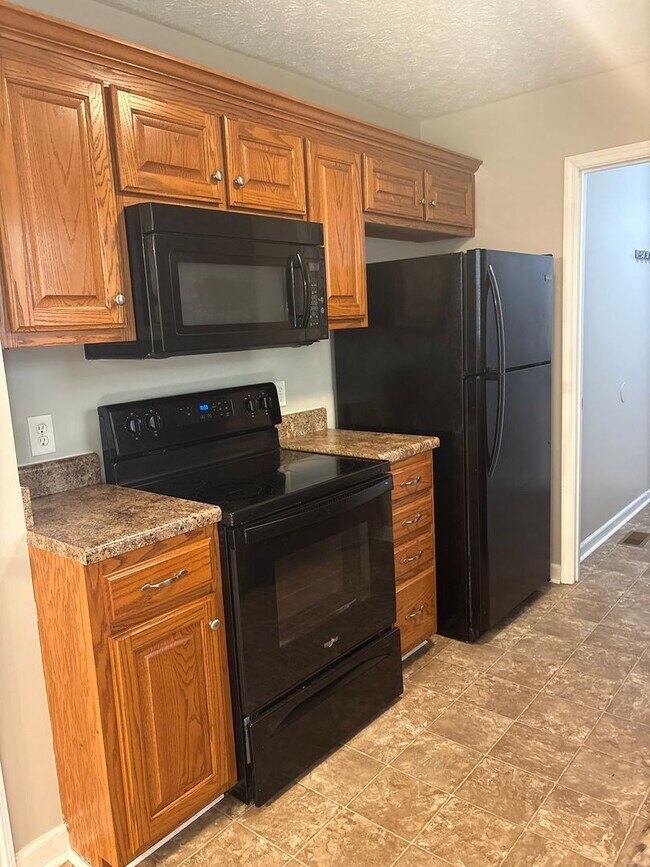 Building Photo - Charming Home with Covered Back Deck and Fenced in Yard...
