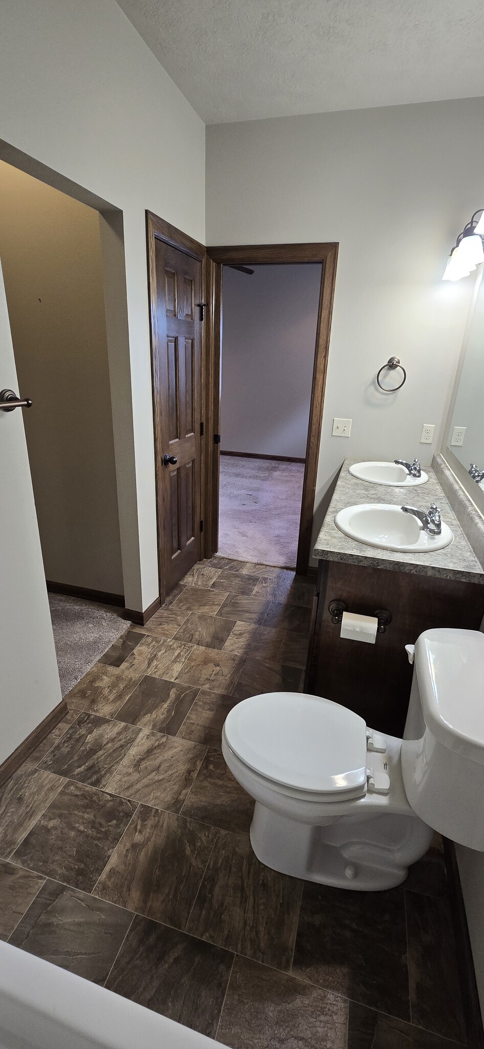 Ensuite Master Bath, Walk in Closet on Left and Pocket Door to Bedroom. - 3511 E Bison Trl