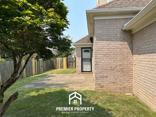 Building Photo - Spacious 3BR/2BA Near Southwind | 1,958 Sq Ft, Brick Fireplace, 2-Car Garage & Quiet Cove