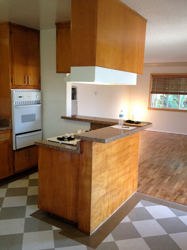 Kitchen range, oven and dry bar. - 12946 Walsh Ave