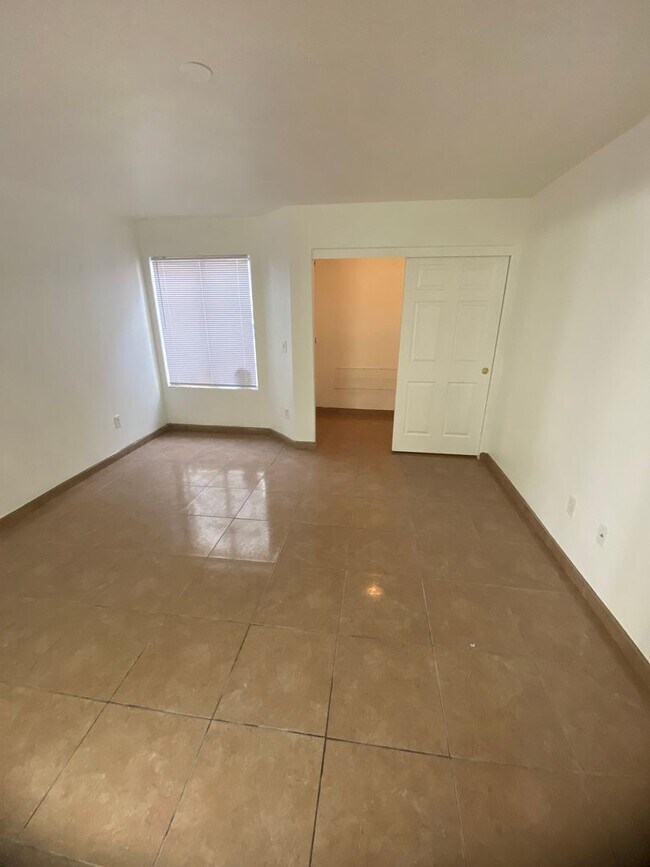 Building Photo - AMERICANA Property Mgmt - Downstairs 2 bed...