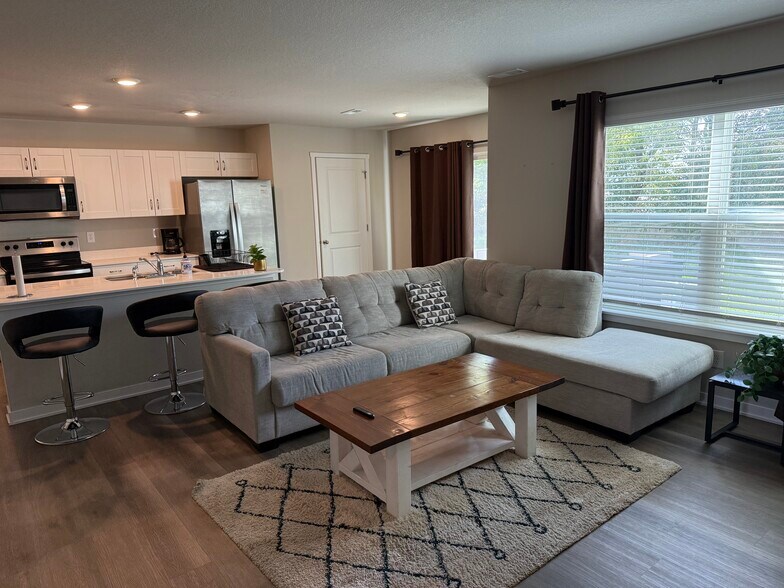 Living room couch, coffee table - 4521 SE Ember Ln