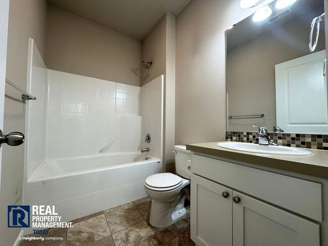 Building Photo - Spacious 4-Bedroom Home with Fenced Yard & 2-Car Garage Near JBLM!