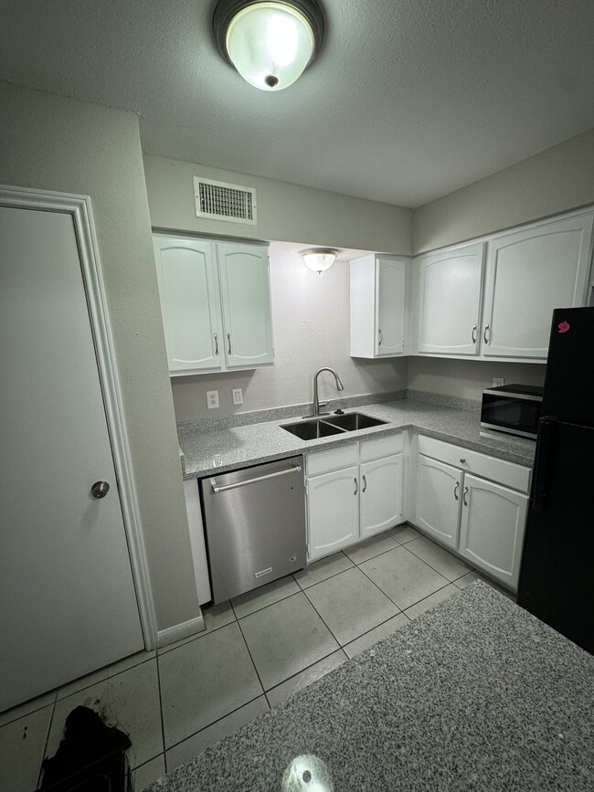 Updated kitchen. New sink, dishwasher and granite countertops - 5528 Deep Forest Dr