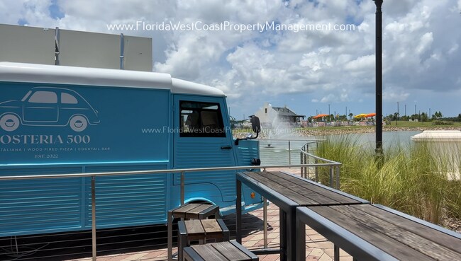 Building Photo - EXCEPTIONAL AND SPACIOUS FURNISHED TOWNHOME WITHIN WATERSIDE- NAUTIQUE!