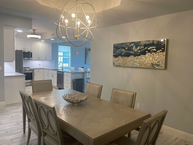 Building Photo - Coastal Luxury at Hidden Bay | 3BR Waterfront Condo with Bay Views