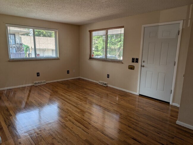Living room with newly finished wood floors - 1160 Clinton St