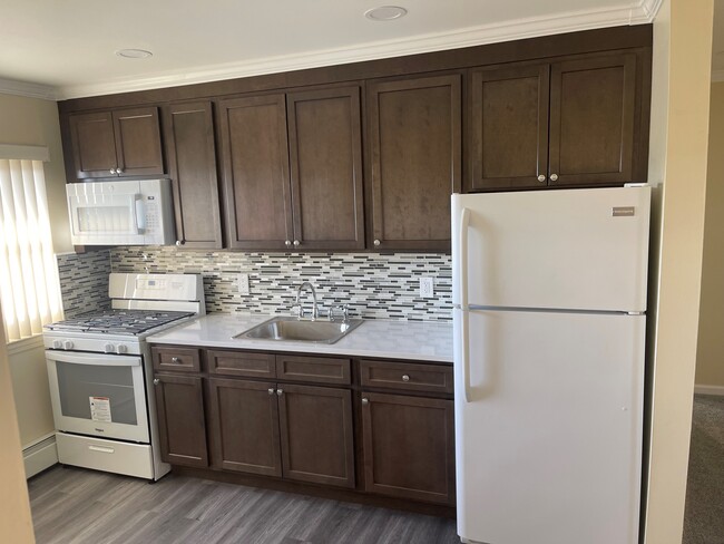 Newly renovated kitchens - The Niche at 7th Street Gardens