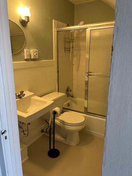 Bathroom has a built in medicine cabinet and shelves - 784 Farmington Ave