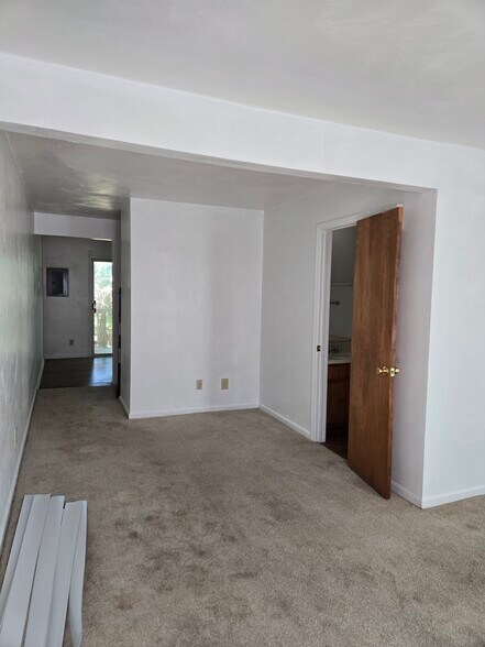 Den with view of kitchen and half bath - 2032 Elmhurst Ln