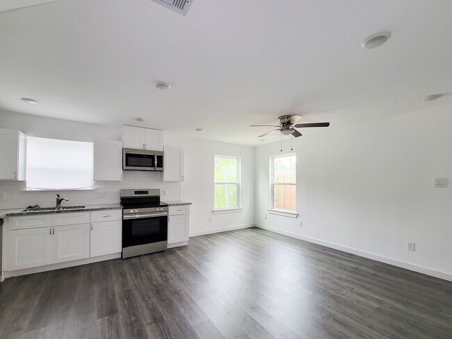 Building Photo - This newly constructed 3-bedroom, 2-bathroom unit offers modern living with 1,150 sq ft of space....