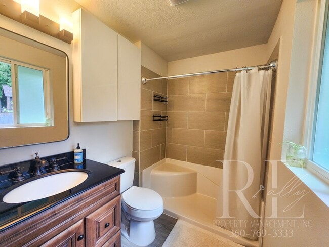 Building Photo - Rambler with Fantastic Covered Deck & Community Pool