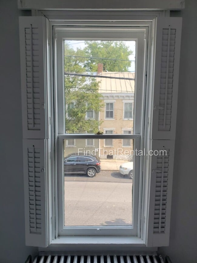 Building Photo - Charming Historic Retreat with Private Fenced Yard & Parking – Prime Downtown Location