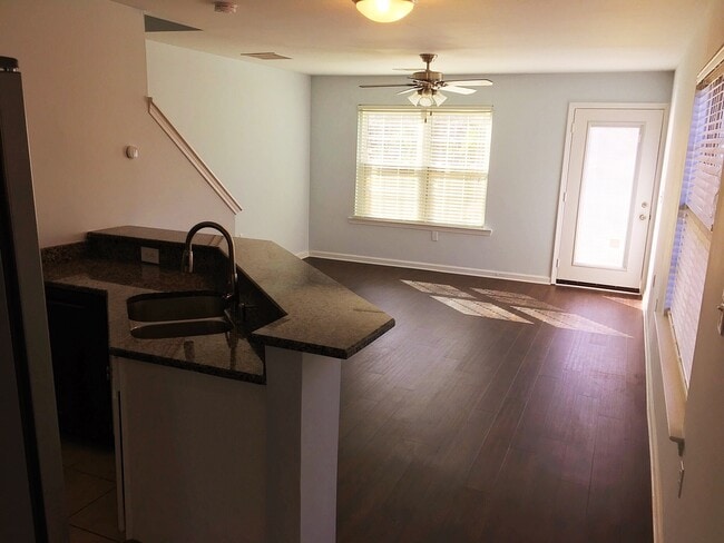 A large living room area with plenty of light and access to the back yard through patio door - 190 Hutchinson St NE