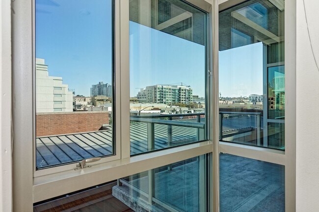 Building Photo - Modern Downtown Condo in Premier High-Rise...