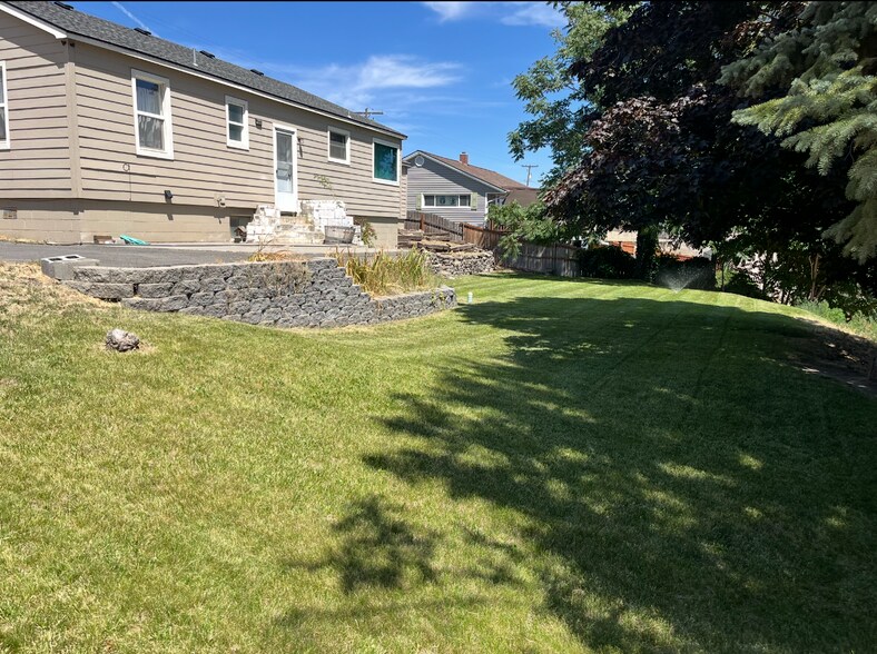Backyard has a patio to sit out on and enjoy the views. The yard has new underground sprinklers. - 501 W Grandview Ave