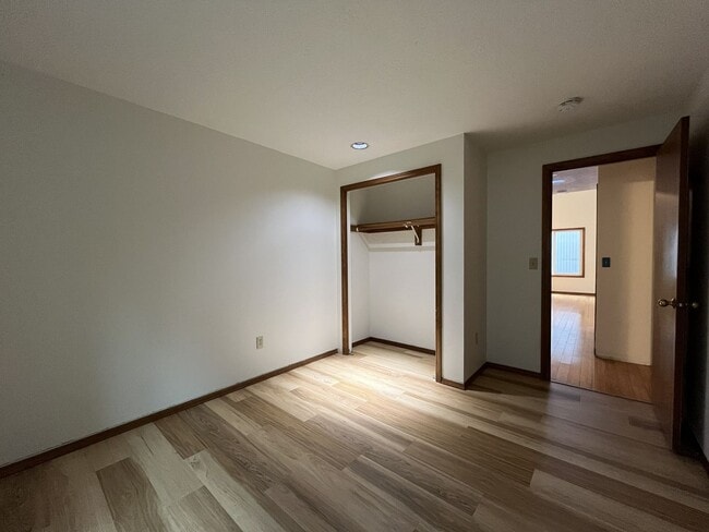 Building Photo - Spacious 3-Bedroom Home with Custom Stone Fireplace, Attached 2-Car Garage & Expansive Backyard i...