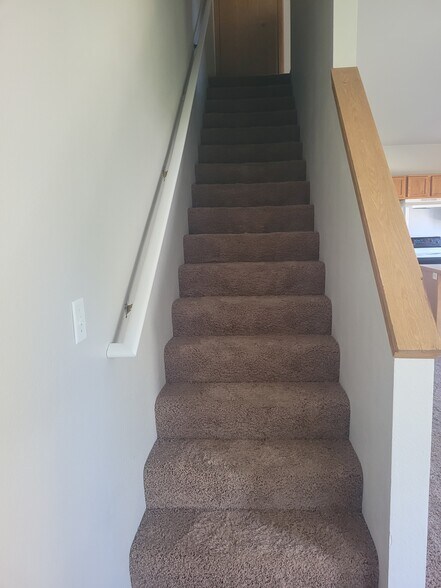 Stairs to second floor - 1415 E Maple St