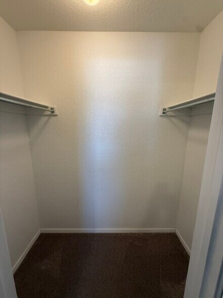 Walk in closet in bedroom 2. - 5074 W Claxton Circle