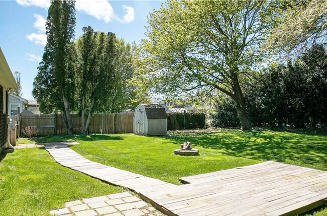 Backyard, fenced in with firepit - 17 Wood Rd