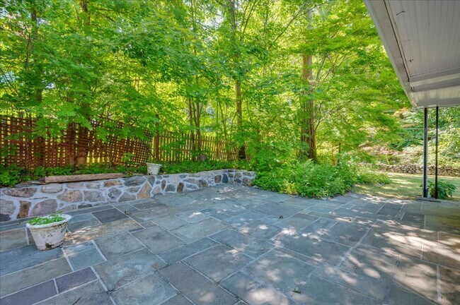 Building Photo - Elegant Multi-Level Brick Residence with Outdoor Oasis