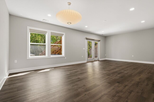 Building Photo - Move-In Ready 4BR Home | Deck, Patio & Open Concept Living