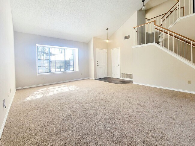 Building Photo - Warm & Inviting 4BR / 2.5BA Home with Covered Deck and 2-Car Garage