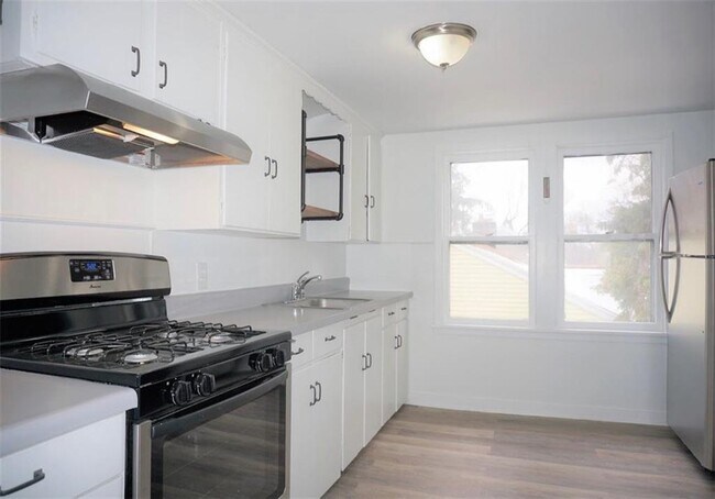 Galley kitchen with newer stove, oven and refrigerator. - 264 Cobb Ter