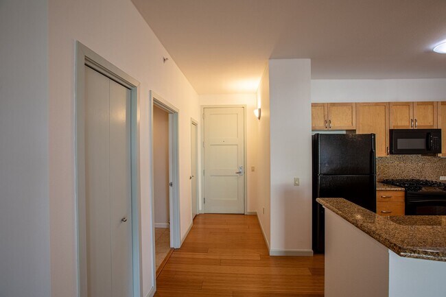 Building Photo - Sweet + secure 1/1 condo with parking, extra storage room + AC available now!