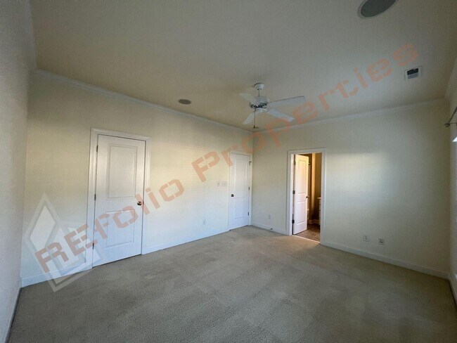 Building Photo - Elegant 3 Story 3 Bedroom Formal Model Tow...