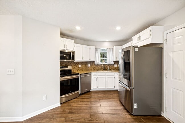 Building Photo - Welcome to this beautifully remodeled sing...