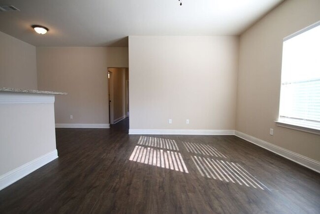 Building Photo - Beautifully Upgraded 3/2 Duplex w/ Garage & Fenced Yard | Off Camp Bowie!
