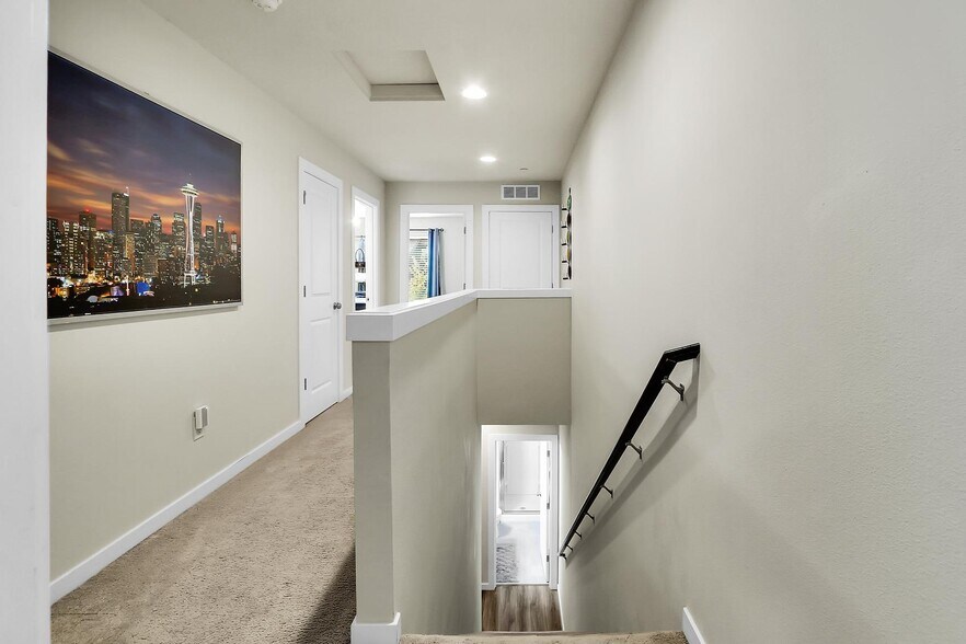 Staircase from main floor to upper floor. - 4206 204th St SW