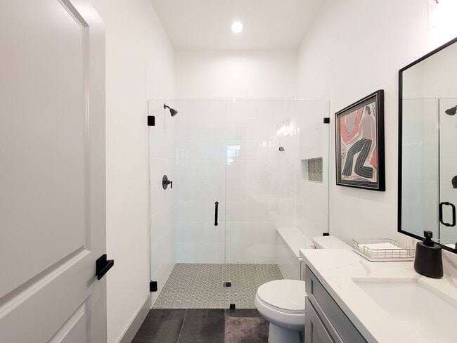 Building Photo - This 4-bedroom, 3-bathroom, two-story residence comes with a generous two-car attached garage. Re...