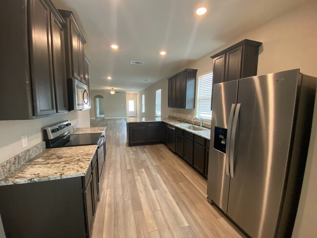 Building Photo - The newly built 4 bedroom and 2 bath home ...