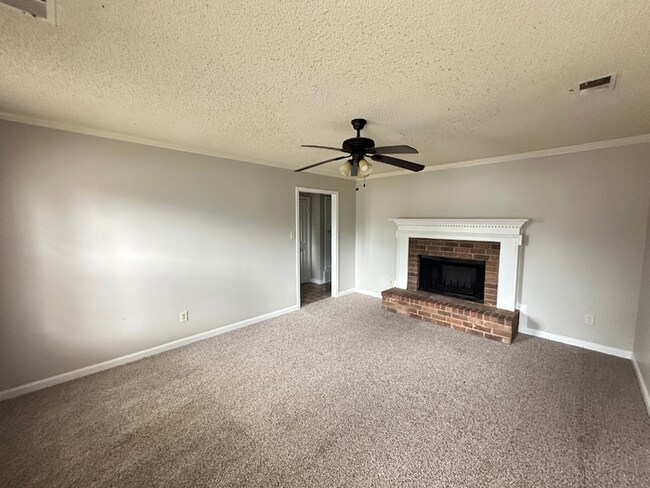 Building Photo - MOVE-IN READY! 3BR/2BA in Quiet Cove | Brick Fireplace | Fenced Yard & Patio!