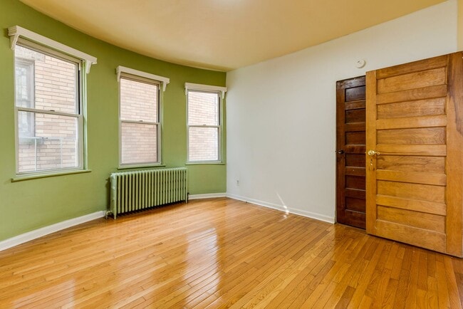 Building Photo - AVAILABLE June 2026 - Beautiful 4 Bedroom, 2 Bath Home w/ Front Porch Swing!