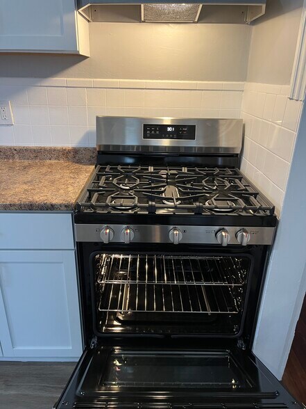 New SS self-cleaning gas stove. - 42 Seymour Ave