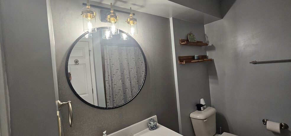 New bathroom lights and mirror - 408 La Fontenay Ct