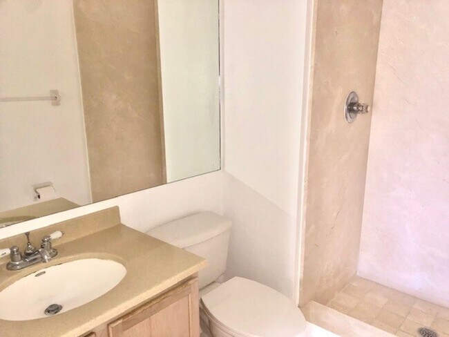 Building Photo - Nice 2X2 located on 2nd floor- Tile & lami...