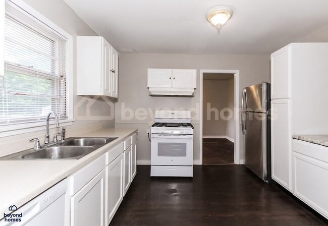 Building Photo - Updated Bungalow with Massive Deck and Fully Fenced Yard!