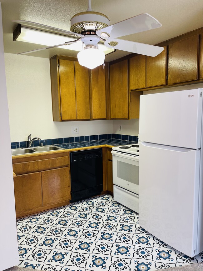 Kitchen, new flooring, new refridgerato, range and dishwasher - 6330 Genesee Ave