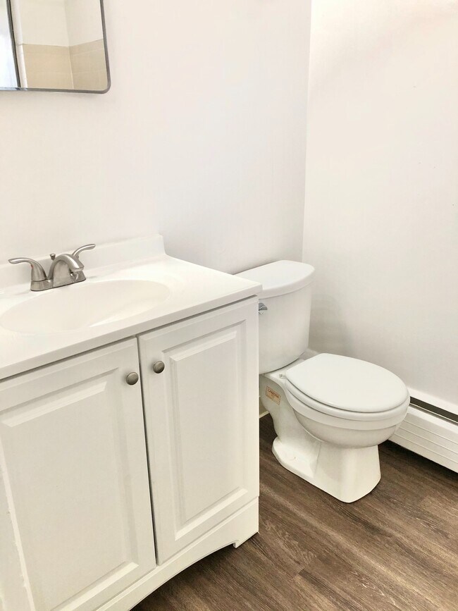 Experience the simplicity and cleanliness of this contemporary bathroom. - GRACE LANDINGS APARTMENTS